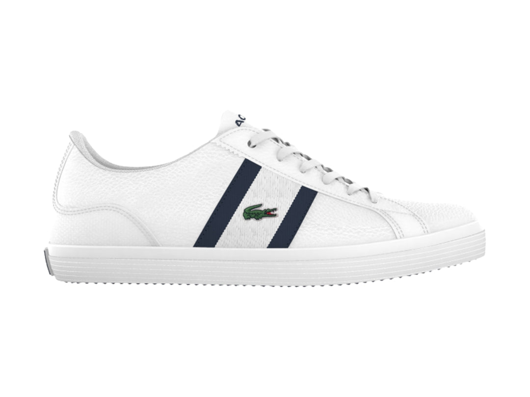 Tenis blancos Lacoste Lerond para hombre con dos franjas azul marino laterales y suela blanca.