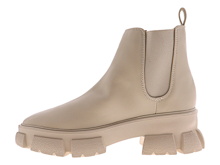 Bota combat color nude para mujer con suela de plataforma gruesa y acabado mate.