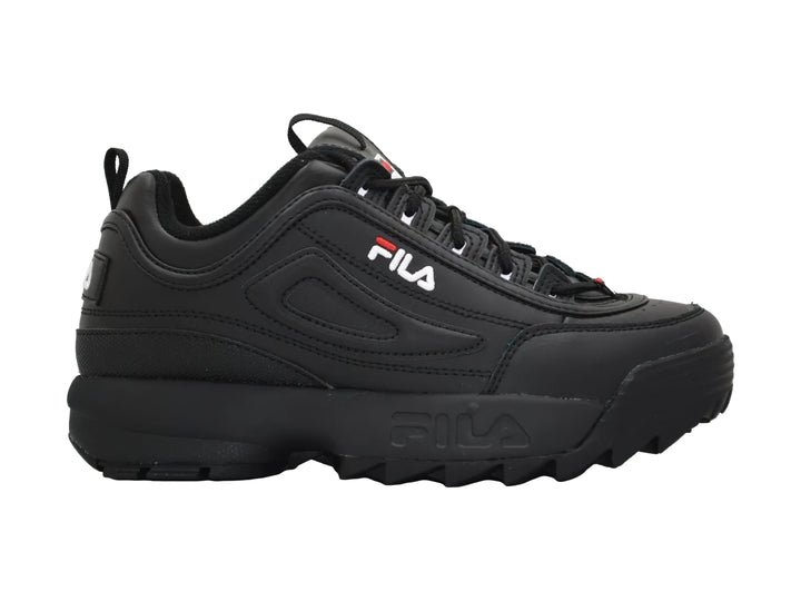 Tenis FILA Disruptor II Premium en color negro con suela robusta y dentada para niños.