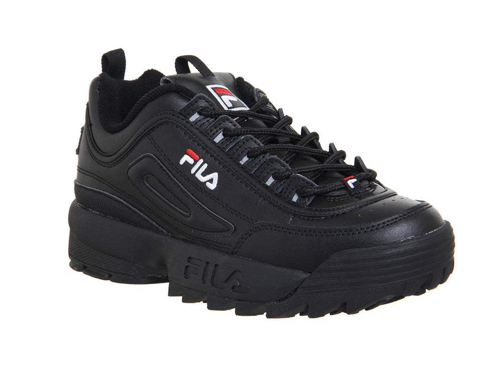 Tenis FILA Disruptor II Premium en color negro con suela robusta y dentada para niños.