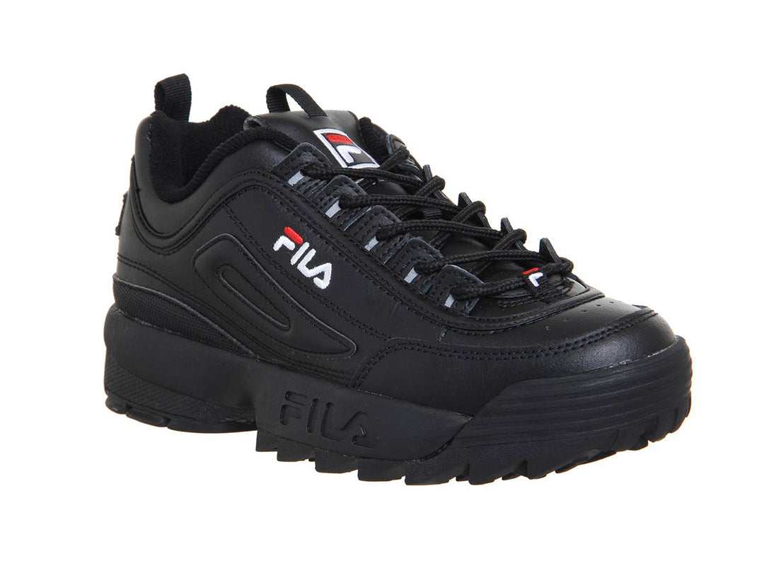 Tenis FILA Disruptor II Premium en color negro con suela robusta y dentada para niños.