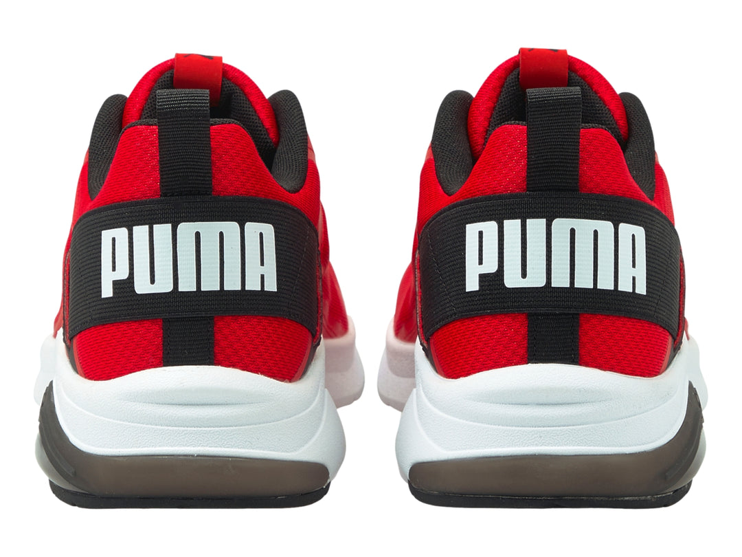 Tenis deportivos PUMA en color rojo con detalles en negro y suela blanca.