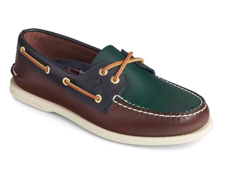 Zapato náutico Sperry multicolor en cuero verde, marrón y azul marino con suela blanca.