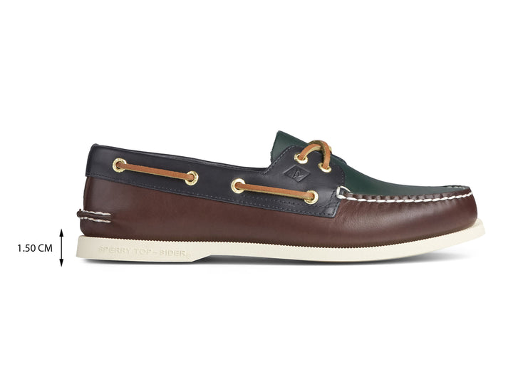 Zapato náutico Sperry multicolor en cuero verde, marrón y azul marino con suela blanca.