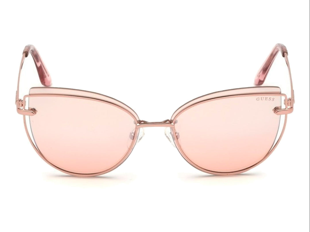 Lentes de sol GUESS modelo GU 7617 en color rosa con forma cat-eye y montura metálica brillante.