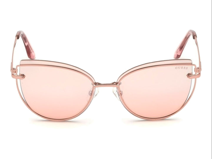 Lentes de sol GUESS modelo GU 7617 en color rosa con forma cat-eye y montura metálica brillante.
