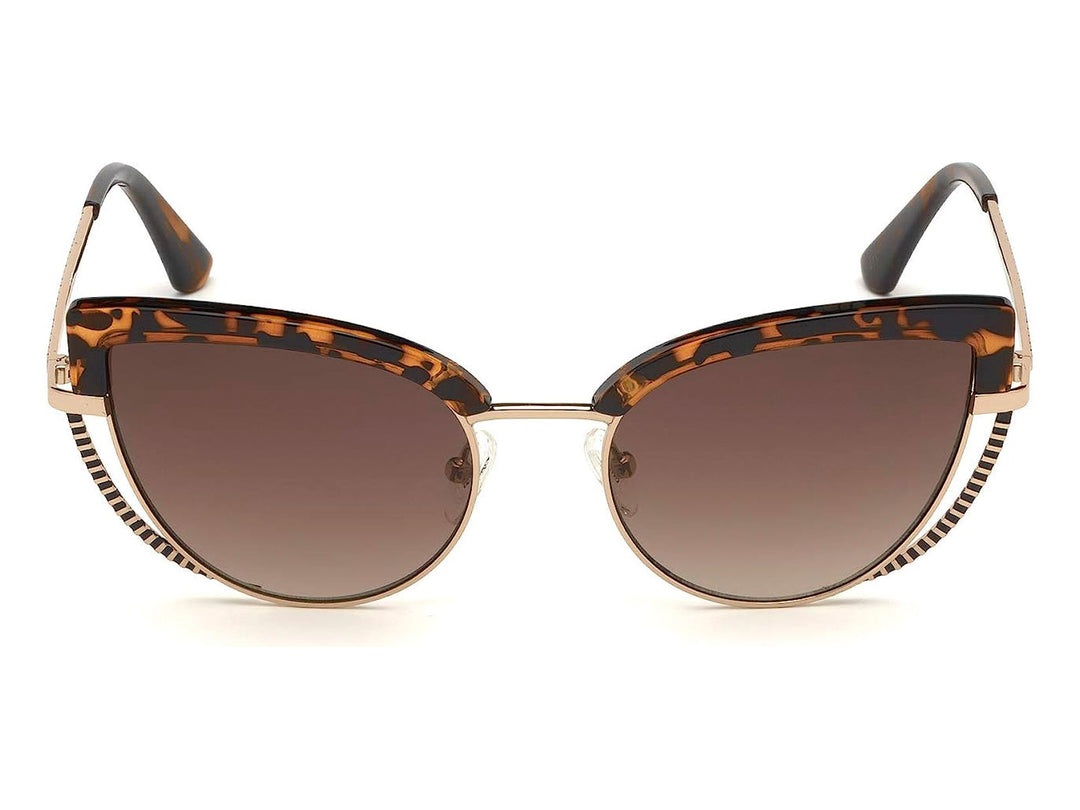Lentes de sol Guess para mujer con armazón en color carey y detalles metálicos dorados en forma de cat-eye.