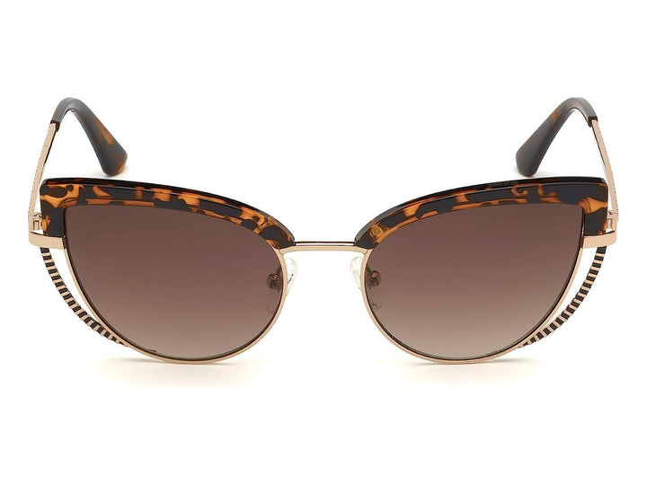 Lentes de sol Guess para mujer con armazón en color carey y detalles metálicos dorados en forma de cat-eye.