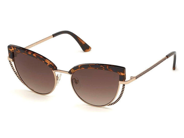 Lentes de sol Guess para mujer con armazón en color carey y detalles metálicos dorados en forma de cat-eye.