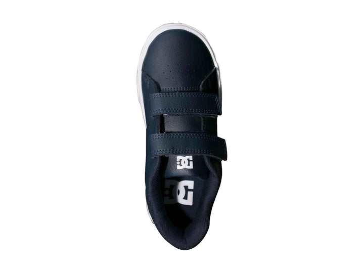 Tenis DC Shoes para niño en color azul marino con suela blanca y cierre de velcro.