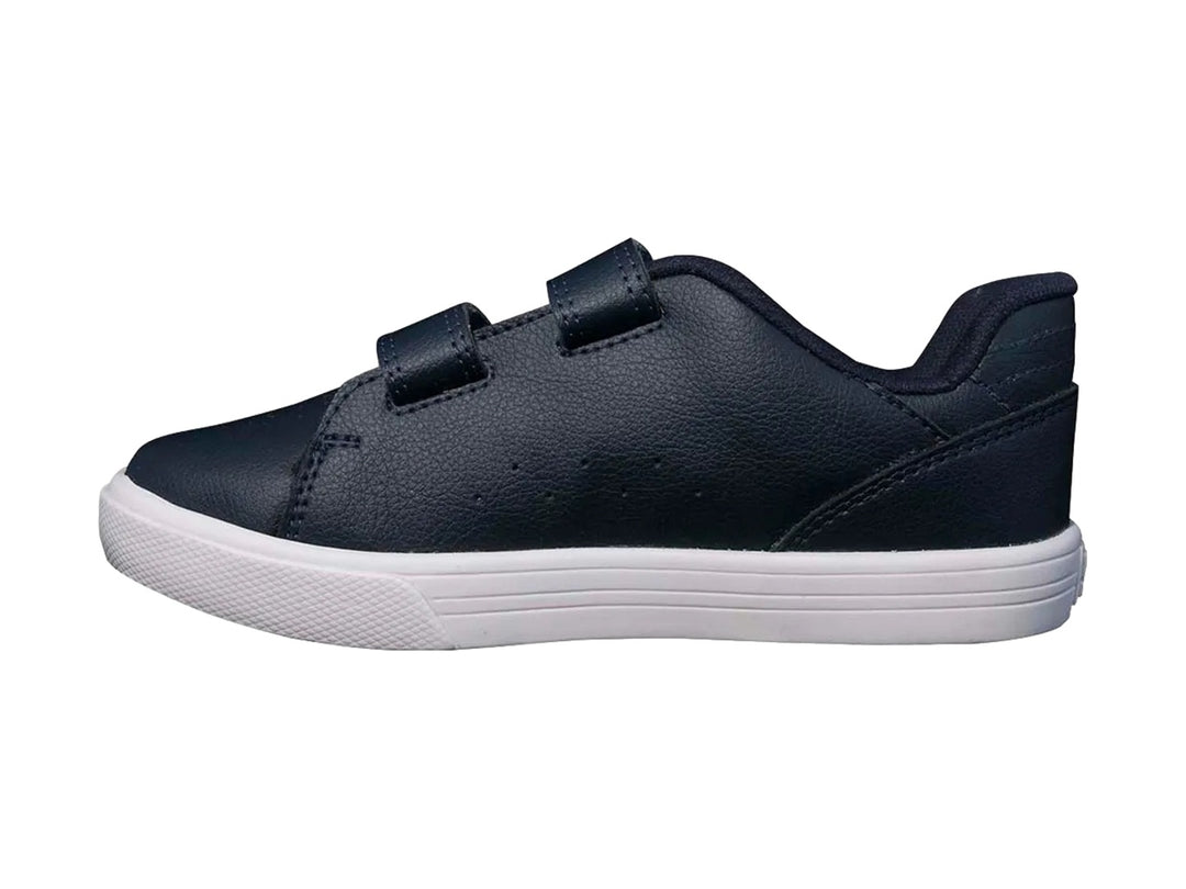 Tenis DC Shoes para niño en color azul marino con suela blanca y cierre de velcro.