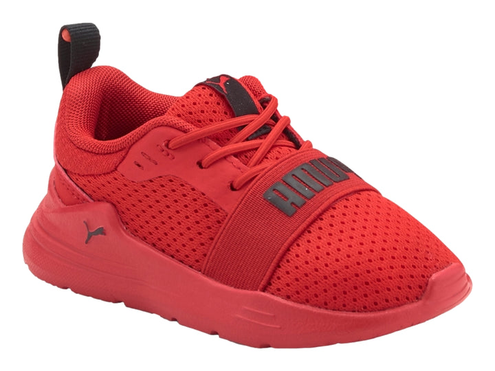 Tenis deportivos PUMA para niño en color rojo con detalles en negro y tejido de malla transpirable.