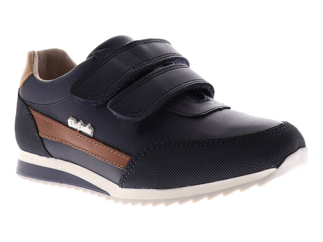 Tenis azul marino para niño con cierre de velcro y suela blanca.