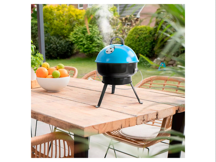 Asador portátil Gibson de color negro con tapa azul brillante y soporte de tres patas.