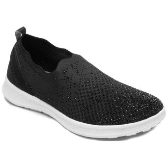 Zapato plano Flexi modelo Helga en color negro con tejido transpirable y suela blanca contrastante.