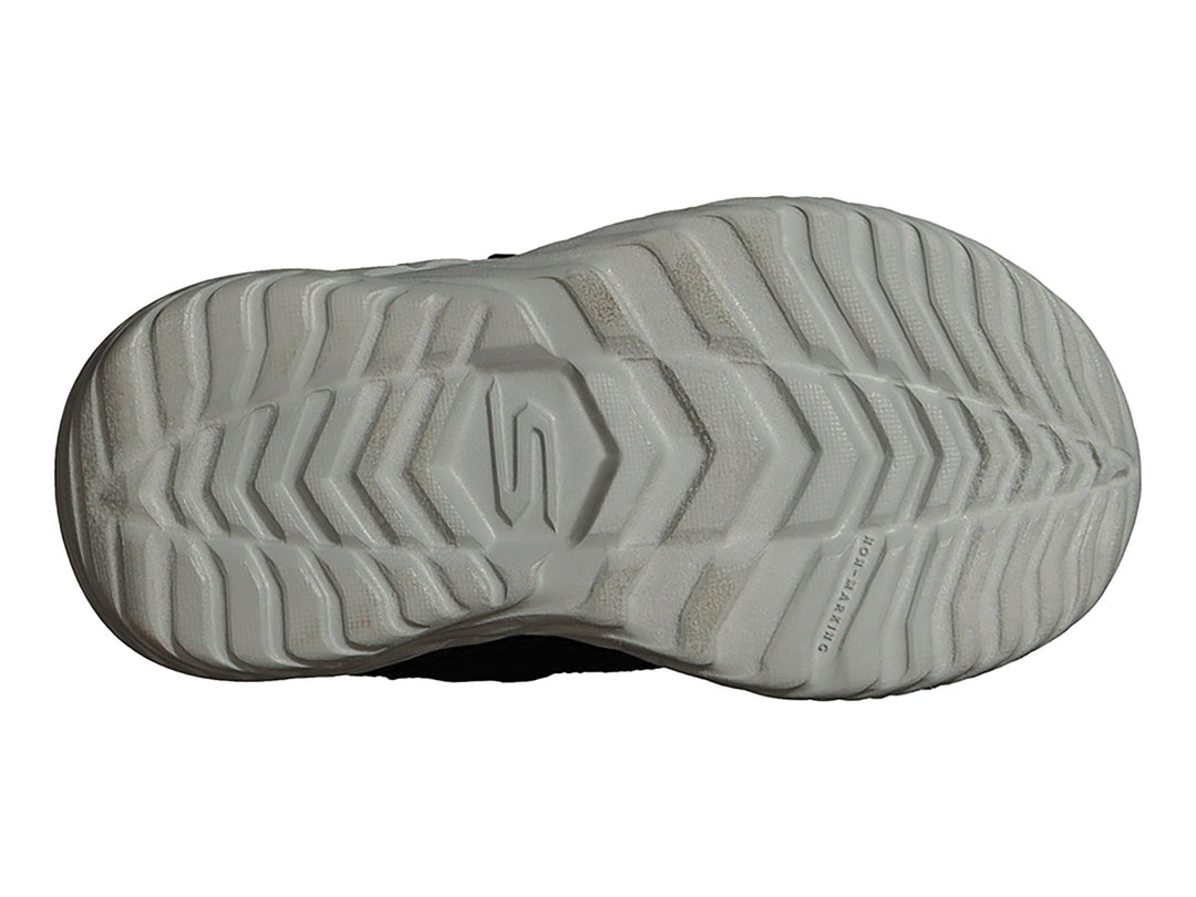 Tenis deportivos Skechers para niño en color azul marino con suela gris y detalles en verde limón.