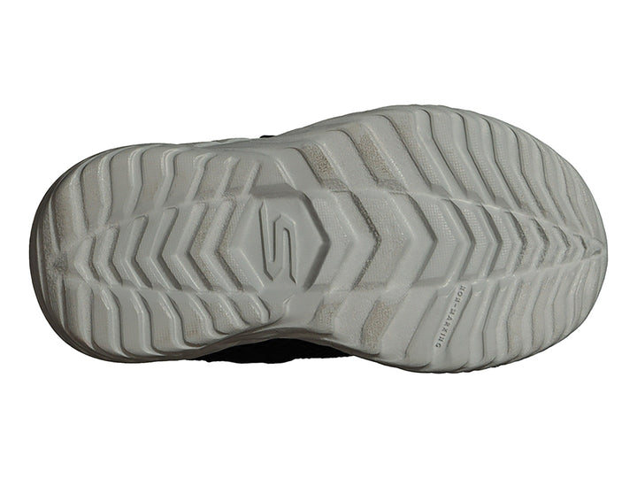Tenis deportivos Skechers para niño en color azul marino con suela gris y detalles en verde limón.