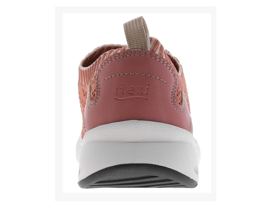 Zapato deportivo Flexi de tejido color rosa con suela blanca y punta negra, diseño sin cordones.