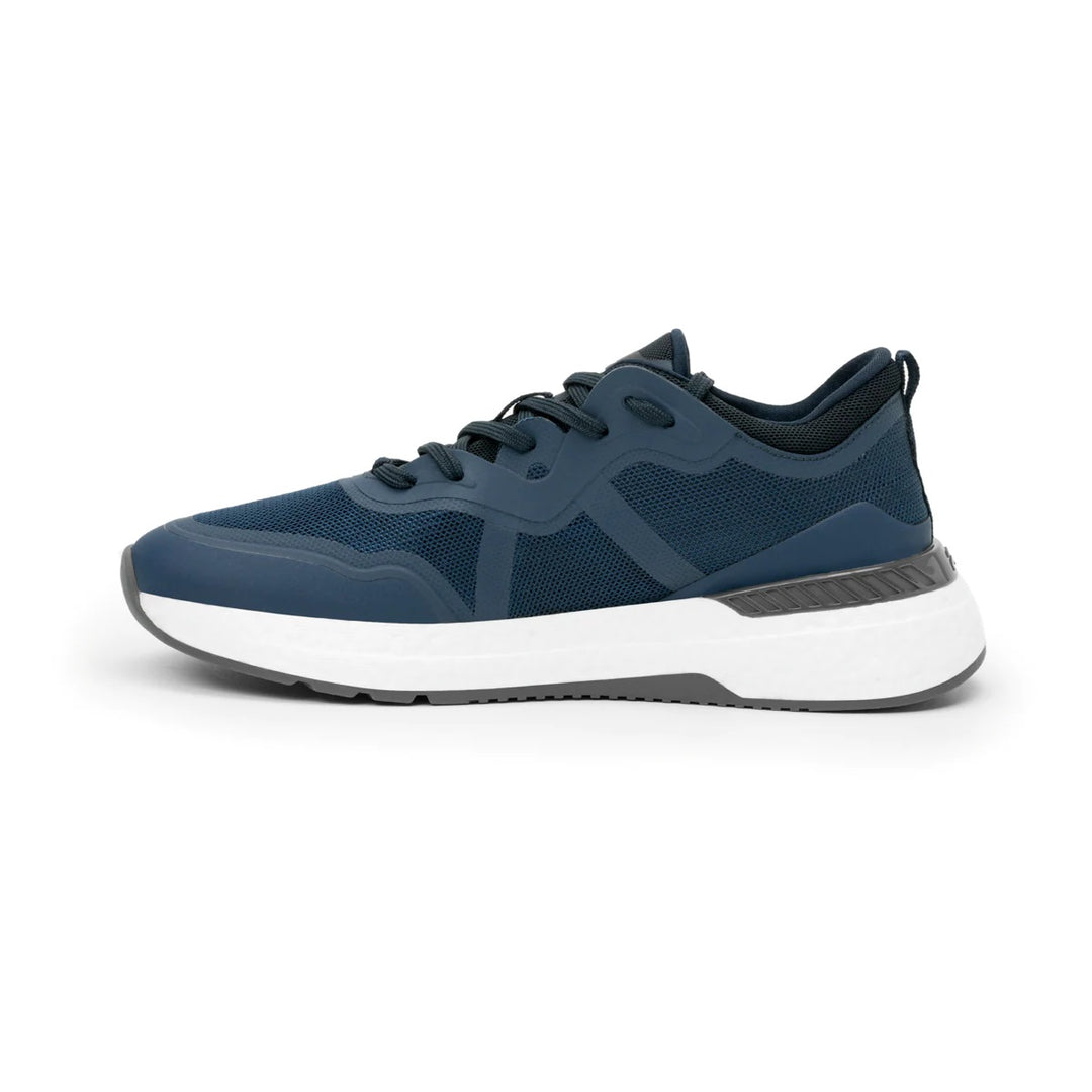 Tenis deportivos Flexi en color azul con suela blanca y detalles en malla sintética.