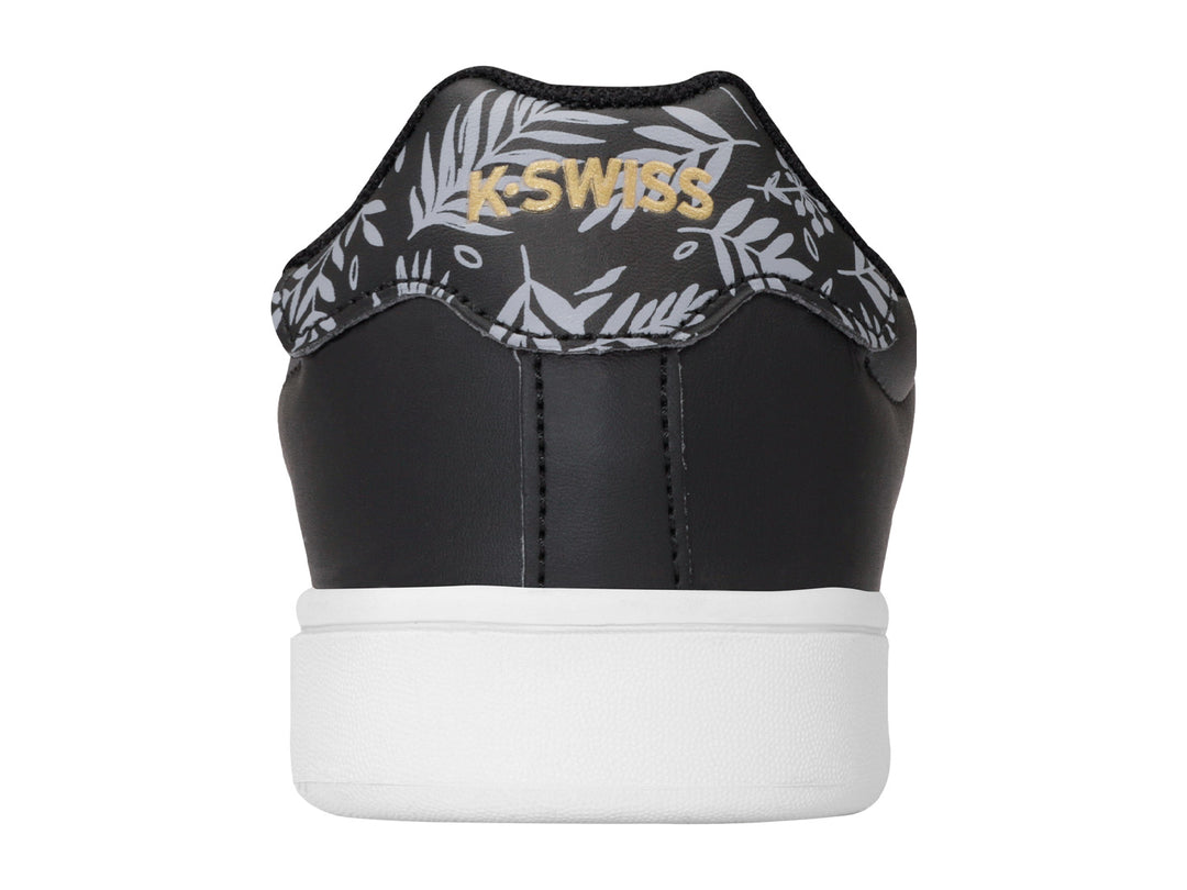 Tenis K-Swiss Bonnet color negro con suela blanca y detalle floral en el talón.