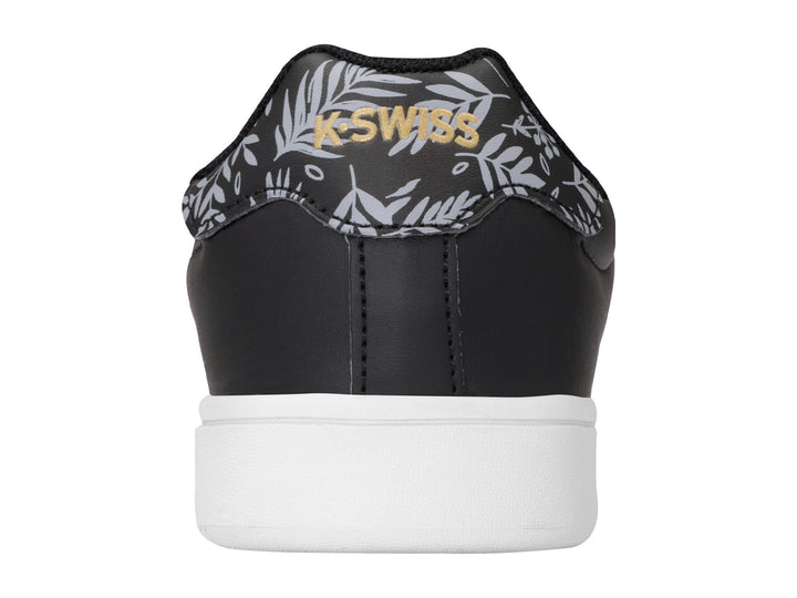 Tenis K-Swiss Bonnet color negro con suela blanca y detalle floral en el talón.