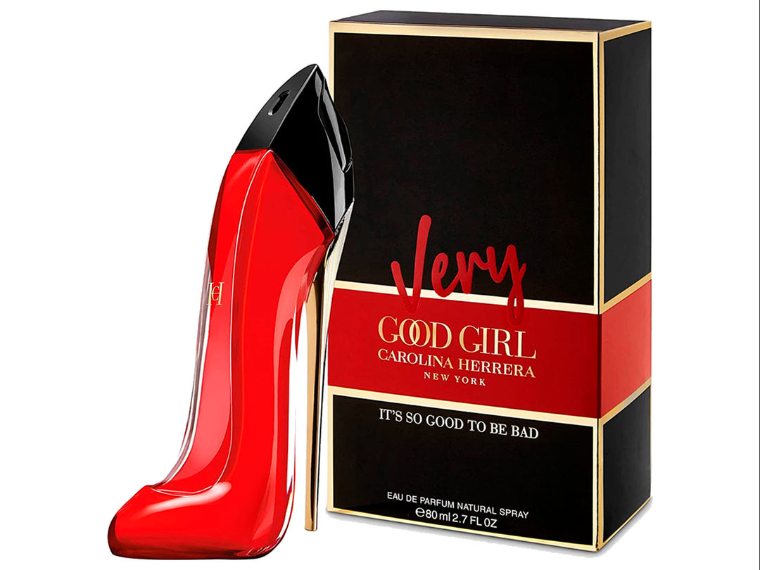 Perfume Carolina Herrera Very Good Girl en frasco con forma de zapato rojo y su caja negra con detalles dorados.