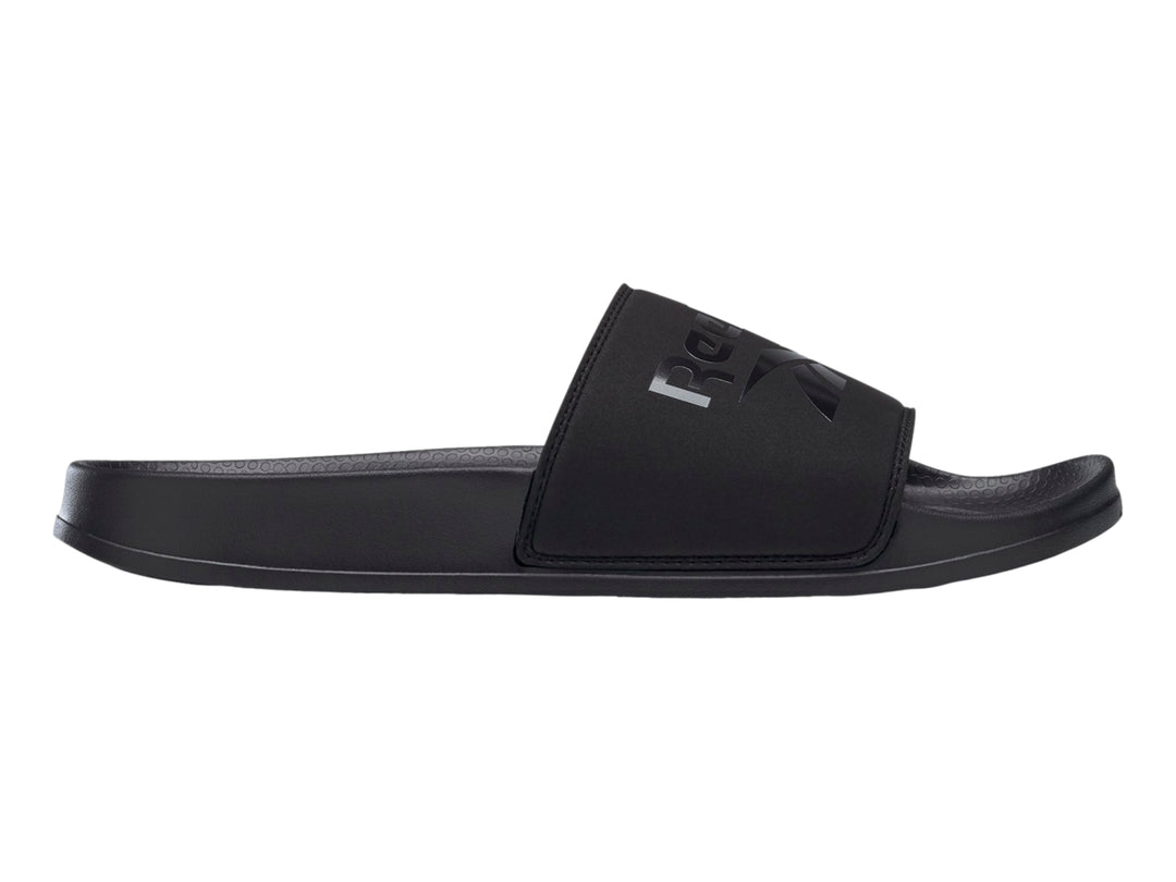 Sandalia deslizable Reebok modelo Fulgure Slide en color negro sólido con logotipo en la banda superior.