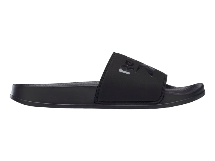 Sandalia deslizable Reebok modelo Fulgure Slide en color negro sólido con logotipo en la banda superior.