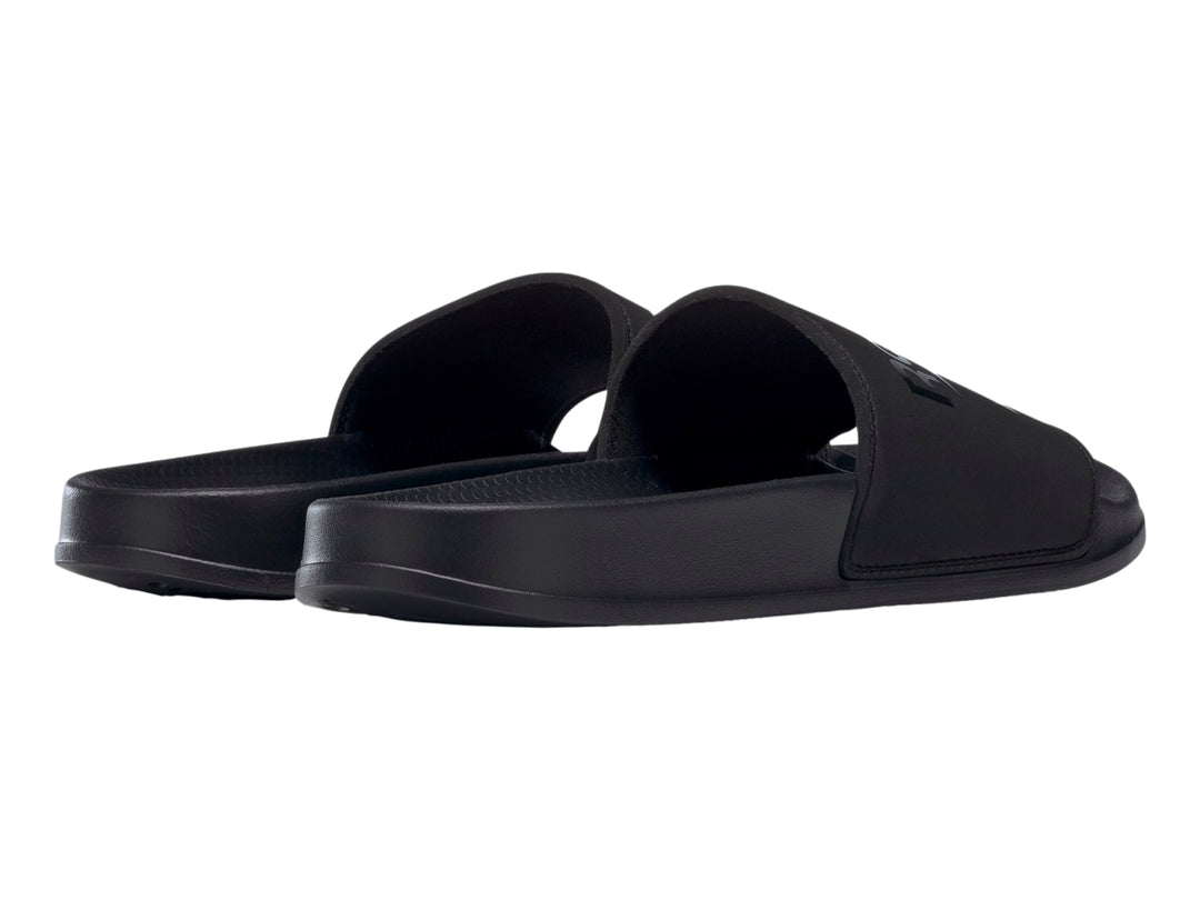 Sandalia deslizable Reebok modelo Fulgure Slide en color negro sólido con logotipo en la banda superior.