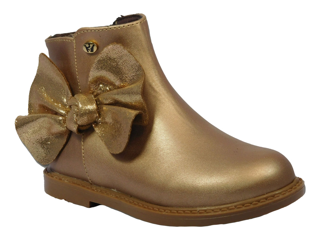 Botines dorados metálicos para niña con un moño decorativo en el lateral.