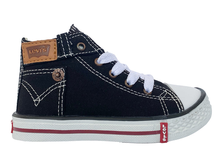 Tenis infantiles de lona color negro con punta y suela blanca.