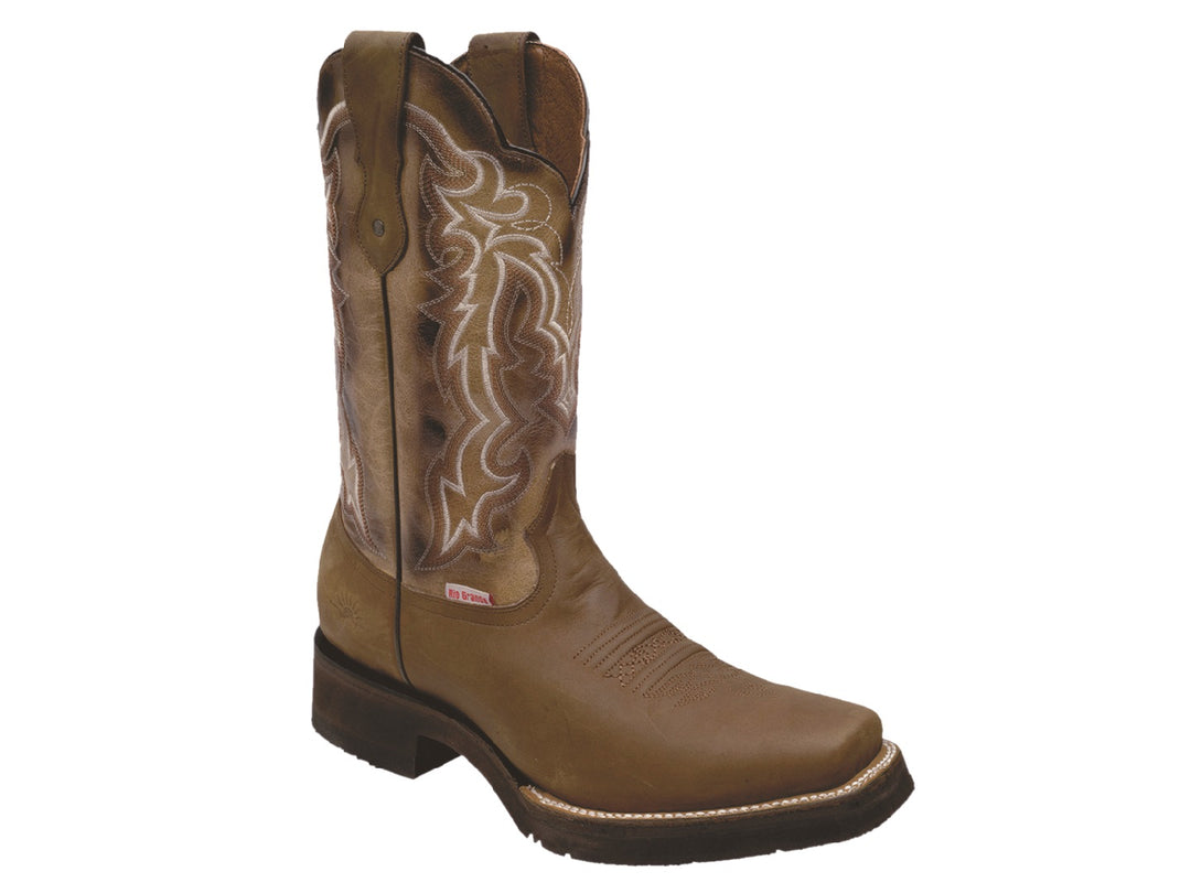 Bota vaquera de cuero color marrón tan con bordados decorativos en la caña y punta cuadrada.