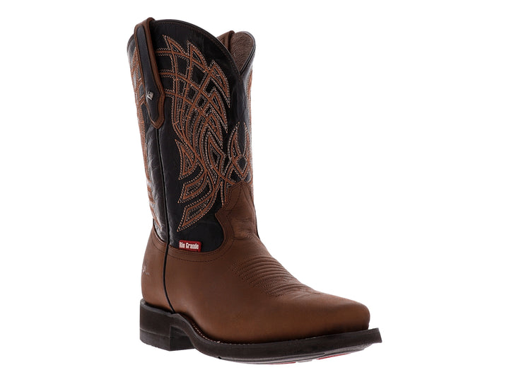 Botas vaqueras para niño de color marrón y negro con detalles bordados en la caña.