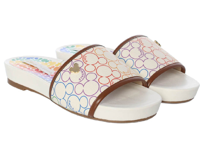Sandalias slide color marfil con estampado multicolor de Mickey Mouse y ribete marrón.