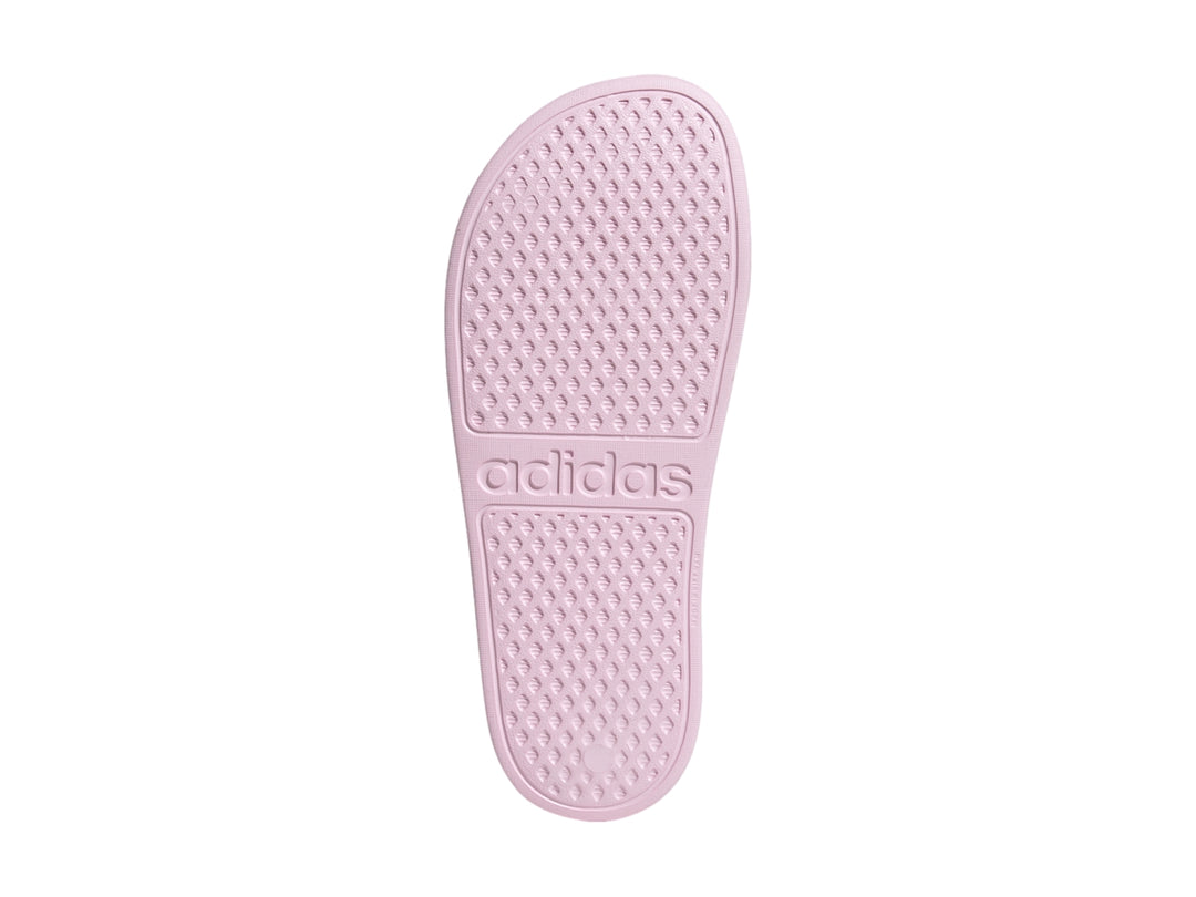 Sandalia Adidas Adilette Aqua para niña en color rosa con tres franjas blancas laterales.