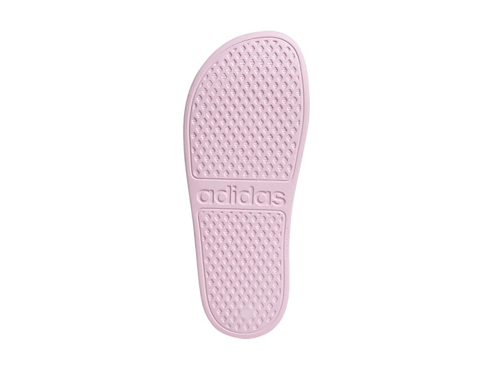 Sandalia Adidas Adilette Aqua para niña en color rosa con tres franjas blancas laterales.