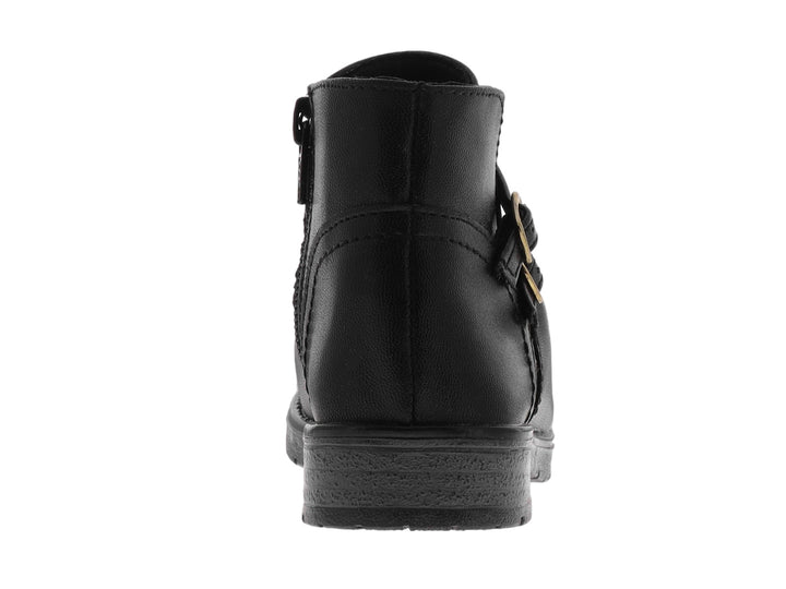 Botas negras de caña corta para niño con dos hebillas doradas decorativas y suela gruesa.