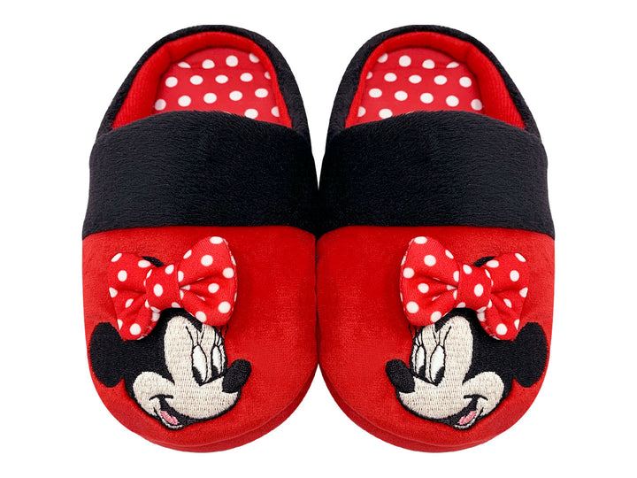 Pantuflas rojas y negras de Minnie Mouse para niña con un moño decorativo.