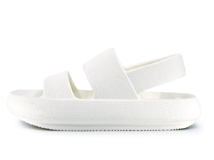 Sandalias blancas para mujer con dos tiras anchas y suela texturizada sobre fondo blanco.