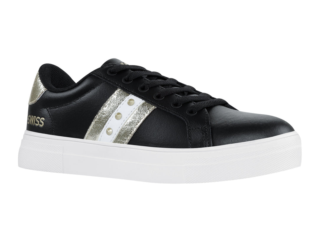 Tenis K-Swiss Radiance para mujer en color negro con franjas doradas y suela blanca.