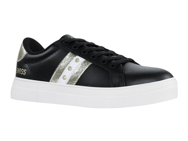 Tenis K-Swiss Radiance para mujer en color negro con franjas doradas y suela blanca.