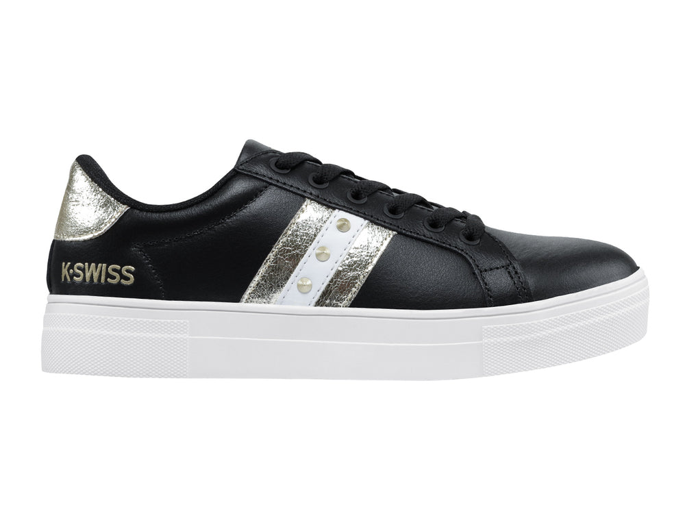 Tenis K-Swiss Radiance para mujer en color negro con franjas doradas y suela blanca.