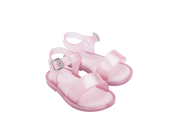 Par de sandalias Mini Melissa color rosa brillante con correas y hebilla para niña.