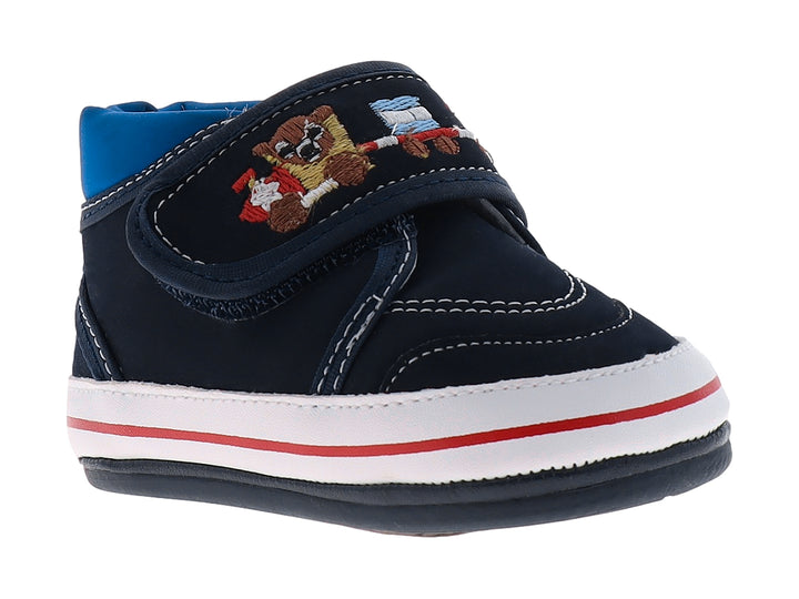 Zapato para bebé color índigo con bordado de oso y suela blanca con una línea roja.