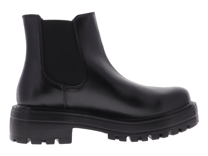 Botín negro de cuero estilo Chelsea con suela track gruesa y plataforma.