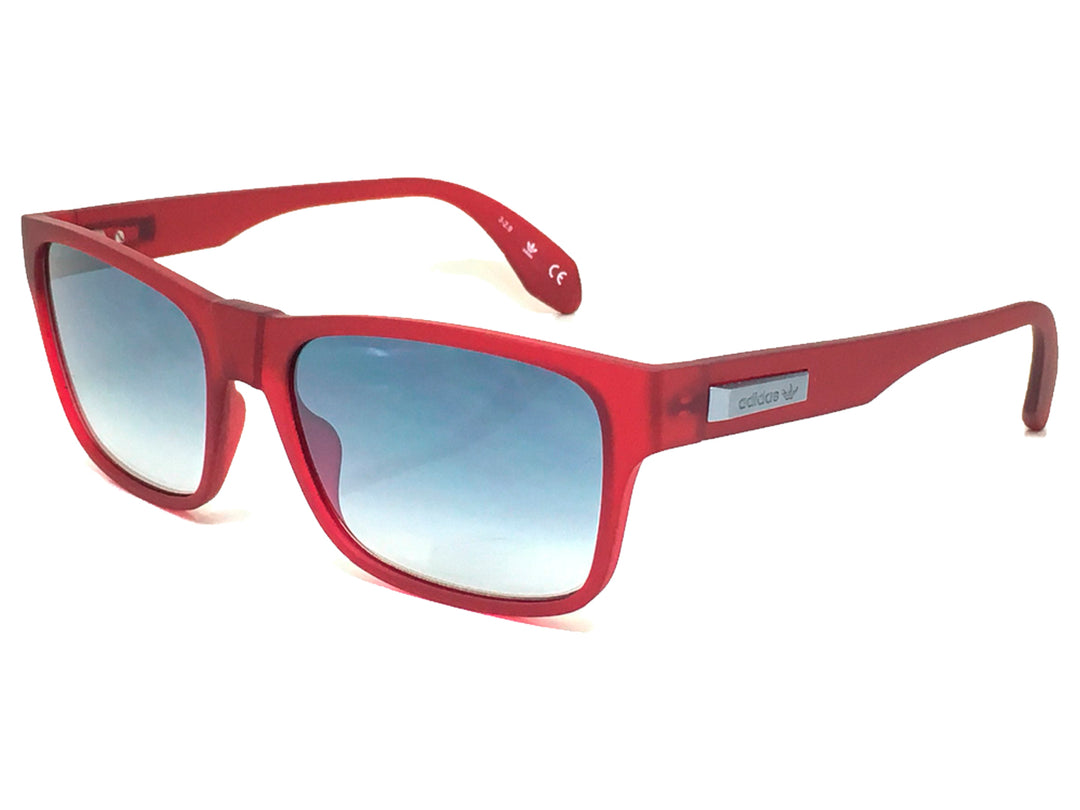 Lentes de sol Adidas Originals color rojo con cristales azules degradados y montura rectangular mate.