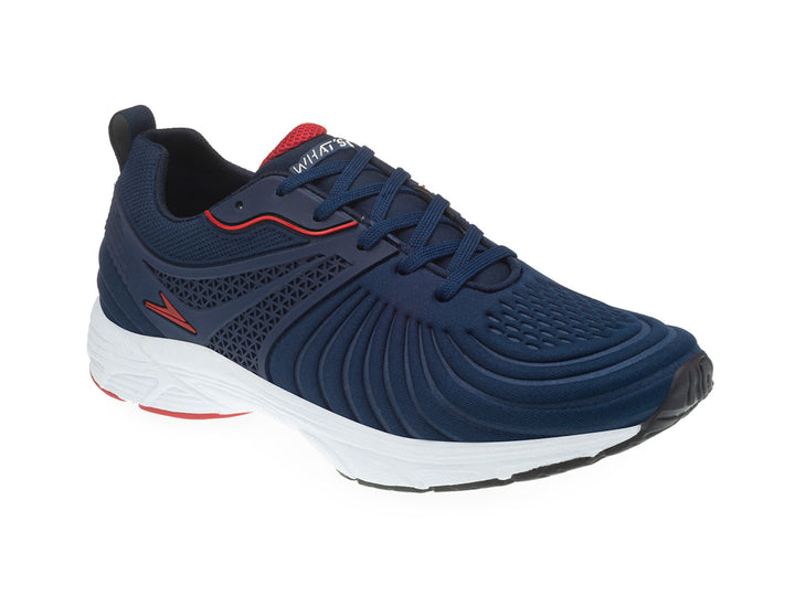 Tenis deportivos para niño en color azul marino con suela blanca y detalles en rojo.