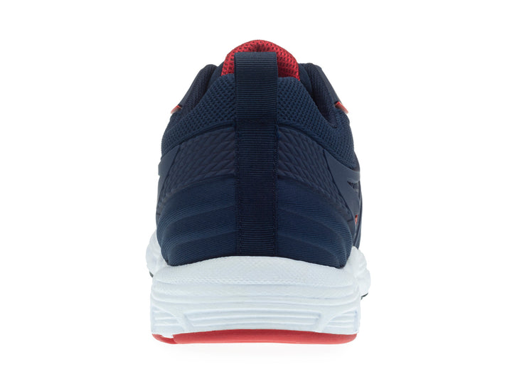 Tenis deportivos para niño en color azul marino con suela blanca y detalles en rojo.