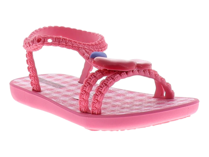 Sandalia Ipanema color rosa con correas de textura tejida y detalle azul en la parte superior.