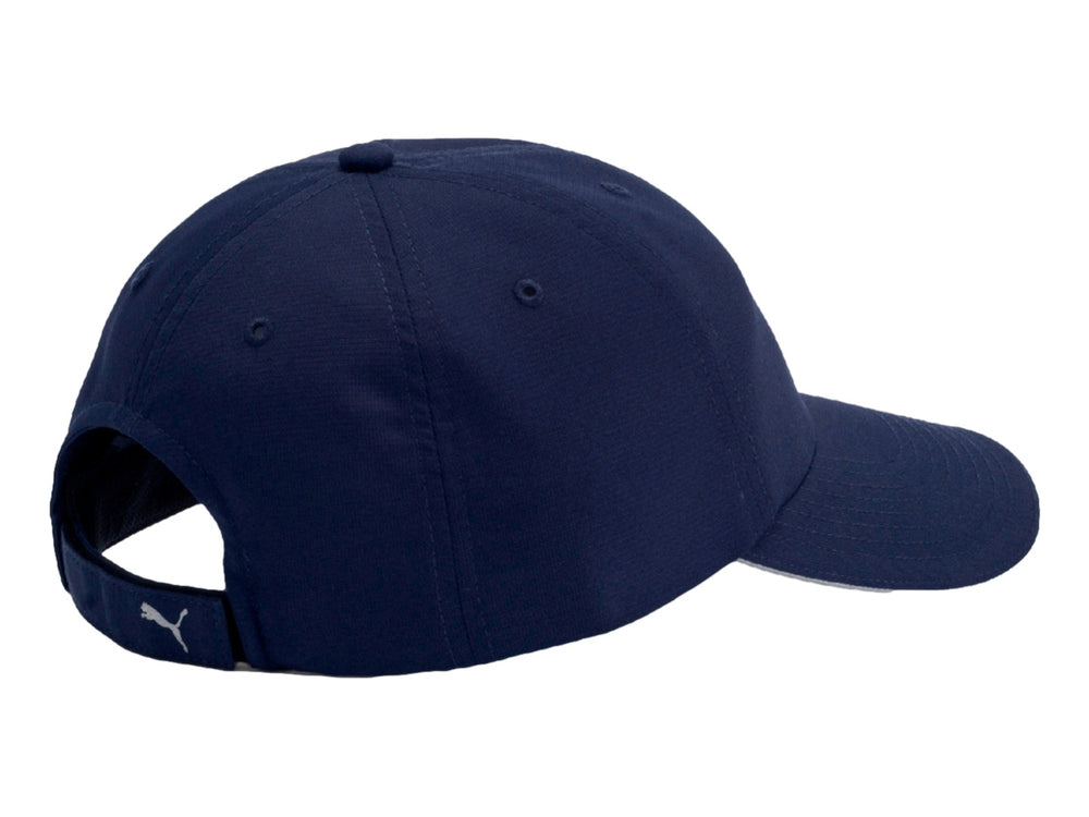 Gorra deportiva PUMA color azul marino con logotipo plateado y visera curva.